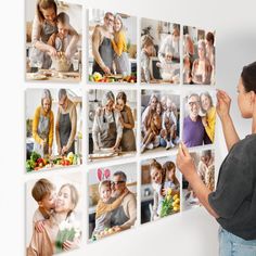 a woman standing in front of a wall with many pictures hanging on it's side