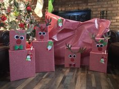 christmas presents wrapped in pink paper with reindeer faces on them