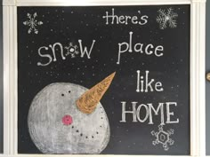 there's snow place like home written on a chalkboard