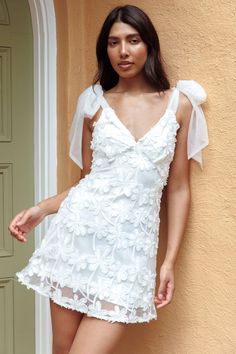 Shop the Mykonos Morning Tied Shoulder Embellished Mini Dress White | Selfie Leslie White V-neck Mini Dress With Tie Straps, Mini Dress With Tie Straps For Brunch, Floral Embroidered Mini Dress For Summer, Embroidered Mini Dress For Vacation, Summer Floral Embroidery Mini Dress, Summer Mini Dress With Floral Embroidery, Summer Floral Embroidered Mini Dress For Day Out, Sleeveless Mini Dress With Floral Embroidery For Brunch, Embroidered Mini Dress For Summer Garden Party