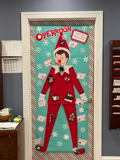 a door decorated with an elf's costume and other items for christmas decorations on display