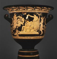 an ancient vase with figures painted on it