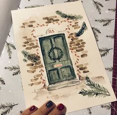 a watercolor painting of a green door with a wreath on it and pine branches