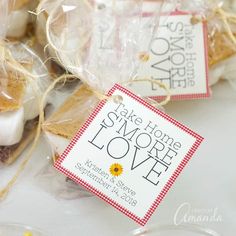 some cookies are wrapped in plastic bags and tied with twine on the top one has a tag that says, make home more love