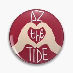 a button that says az the tide with two hands making a heart