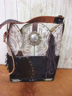 Leather Purse with Fringe- Cowboy Boot Purse - Western Leather Purse TS304 cowboy boot purses, western fringe purse, handmade leather purses, boot purse, handmade western purse, custom leather handbags Chris Thompson Bags Hand Tooled Brown Bags For Rodeo, Brown Hand Tooled Bag For Rodeo, Hand Tooled Brown Bag For Rodeo, Western Style Brown Bag With Concho, Western Brown Bags For Rodeo, Western Style Brown Bags For Rodeo, Brown Leather Bags For Rodeo, Western Bags With Concho Detail, Western Leather Bags With Concho Details