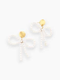 Add a touch of whimsy and elegance to your ensemble with the White Pearl Bow Earrings! Made from stunning faux pearls, these pretty bow dangle earrings are the perfect accessory to elevate your look. Featuring a convenient push back closure and lightweight design, they offer both comfort and style. Whether you're heading to a brunch with friends or a dinner date, these earrings will effortlessly complement your outfit, adding charm to your overall appearance. Features: Pretty bow dangle earrings made from white faux pearls. Convenient push back closure for easy wear. Lightweight design ensures comfort all day long. Adds a touch of whimsy and elegance to your ensemble. Perfect accessory for various occasions, from brunch with friends to a dinner date. Pearl Bow, Date Dinner, Bow Earrings, Dinner Date, White Pearl, Easy Wear, Pearl White, Faux Pearl, The White