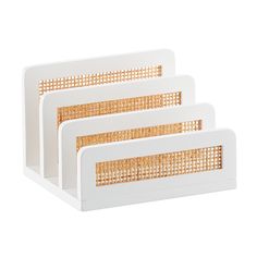 three pieces of white plastic with wicker on the front and sides, set against a white background