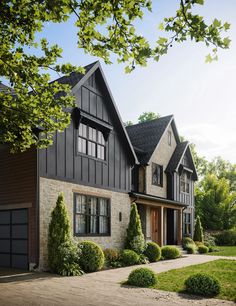 a large house with lots of windows and landscaping