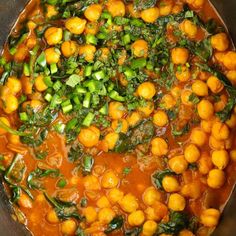 a pot filled with lots of food on top of a stove