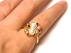 "14k Yellow Gold Cultured Pearl Diamond Ruby Ring Size 8 Total Weight: 4.7 Grams FEEL FREE TO MESSAGE ME WITH A BEST OFFER! 040213-1395 Please contact me if you are interested in purchasing multiple items, I am happy to negotiate and accommodate any request! * Back to Shop Watch and Wares? https://www.etsy.com/shop/watchandwares * Ready to purchase? Click the green button \"Add to cart\" * Have a question? Click the button \"Ask a question\" * Want to save for later/favorite the item? Click the Anniversary Yellow Gold Multi-stone Pearl Ring, Gold Multi-stone Pearl Ring For Anniversary, Gold Multi-stone Pearl Ring As A Gift, Gold Multi-stone Pearl Ring Gift, Gold Cluster Pearl Ring Gift, Ruby And Diamond Ring, Green Button, Pearl Diamond, Multi Stone Ring