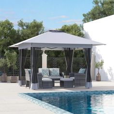 a gazebo sitting next to a swimming pool