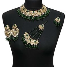 Green bridal jewellery set. Set includes-   Earrings  Tikka Necklace  Jhumar Green Bridal Sets For Diwali Ceremonial, Heavy Jewelry For Eid Celebration, Wedding Jewelry For Eid With Tilla Detail, Ceremonial Green Kundan Bridal Sets, Temple Jewelry For Wedding On Eid, Bollywood Tilla Jewelry For Diwali, Green Jewelry For Wedding On Eid, Bollywood Style Tilla Jewelry For Diwali, Festive Green Stone Work Jewelry