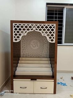 a set of stairs in the shape of a bookcase with an arabic design on it