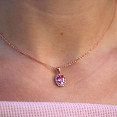 The Charlotte necklace has all the dainty elegance of royalty, with a generous 1.8ct peachy-pink created sapphire center, mine-free diamond halo, and delicate chain of 14k rose, yellow, white gold, or platinum. This gorgeous pendant can be paired with the peachy-pink sapphire Charlotte ring. Details: 16-18" adjustable chain with lobster clasp 14k white, yellow, or rose gold, or platinum 9x7mm (1.8ct equivalent) peachy-pink created sapphire center stone 0.21ct total weight — lab-grown diamonds *A Pink Sapphire Jewelry With Halo Design, Oval Pink Sapphire Rose Gold Jewelry, Oval Rose Gold Pink Sapphire Jewelry, Rose Gold Oval Pink Sapphire Jewelry, Fine Jewelry Pink Oval Necklace, Pink Oval Fine Jewelry Necklaces, Pink Oval Fine Jewelry Necklace, Elegant Pink Sapphire Jewelry With Halo Design, Elegant Pink Sapphire Halo Jewelry