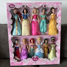 there are many princess dolls in the box