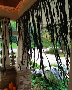 the porch is decorated with halloween decorations