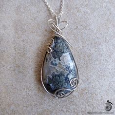 "This pendant showcases a striking drop of marcasite in agate that I wire wrapped in sterling silver. The marcasite blooms and billows against the agate. Marcasite is a sibling mineral to pyrite, they're made of the same elements but form differently. (Trivia: Most of the vintage jewelry called marcasite, is actually pyrite! True marcasite is rarer. The two minerals weren't seen as different things until after jewelers starting using the name.) It has the same metallic sheen as pyrite, but a mor Pyrite Pendant, Science Jewelry, Art Nouveau Pendant, Bijoux Fil Aluminium, Fossil Jewelry, Coral Pendant, Shell Jewelry, 925 Sterling Silver Chain, Shell Pendant