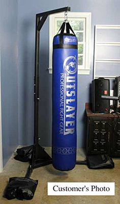 a blue punching bag sitting in the corner of a room