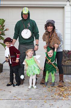 the family is dressed up as tinkerbells and peter panter for halloween