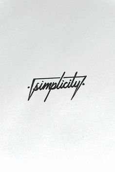 the word simplicity is written in cursive ink on a white paper