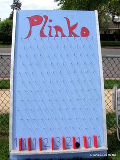 a sign that says pinko on it in front of a fence