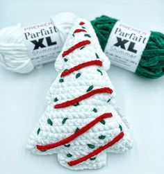 crochet christmas tree ornament with red, white and green yarns