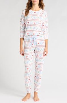 These peachy-soft pajamas printed with a festive Fair Isle pattern will you keep cute and comfy this holiday season and beyond. 24 1/2" top center front length; 30" inseam;, 9" leg opening; 10 1/2" front rise; 15" back rise (size Medium) Top has crewneck; long sleeves with ribbed cuffs Bottoms have elastic/drawstring waist; ribbed cuffs 81% polyester, 14% rayon, 5% elastane Machine wash, tumble dry Imported Womens Christmas Pajamas Target, Relaxed Fit Long Sleeve Christmas Sleepwear, Playful Cotton Holiday Sleepwear, Winter Long Sleeve Sleepwear With Character Print, Playful Long Sleeve Christmas Sleepwear, Short Loungewear, Soft Pajamas, Shopping Event, Sleepwear Women