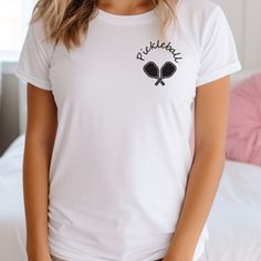 Hello and thanks for visiting my shop! You'll love this Pickleball tee designed by me as it's made from one of the highest quality t-shirt manufacturers in the market. It's soft, easy to layer and breathable so it's perfect for active and leisure wear. There is also a tear away label so no more itchiness! How to Order: 1- Select a Size 2- Pick a color 3- If available, add any customization or a remark to the seller. 4- Place the item in your shopping basket. 5- Return to the previous page to add Sporty T-shirt With Team Name For Tennis, Crew Neck Tennis T-shirt With Team Name, White Tennis Top With Team Name, Pickleball Graphic Tee With Screen Print, Pickleball Sports Season Graphic Print T-shirt, Pickleball Sports Season Graphic T-shirt, Team Spirit T-shirt For Pickleball With Short Sleeves, White T-shirt With Team Name For Pickleball, Sports Season T-shirt With Team Name For Pickleball