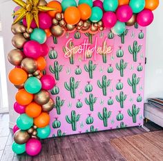 the balloon arch is decorated with colorful balloons