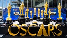 an oscar statue is displayed in front of the academy awards