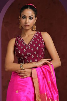 Wine saree blouse with hand embroidered zardozi floral motifs.
Component: 1
Pattern: Embroidery
Type Of Work: Zardozi
Neckline: V neck
Sleeve Type: Sleeveless
Fabric: Crepe
Color: Wine
Other Details: 
Low back with tie up and tassels
Closure: Front hook
Note: Saree worn by the model is not for sale
Occasion: Sangeet - Aza Fashions Designer V-neck Choli With Resham Embroidery, Festive V-neck Embroidered Top For Wedding, Embroidered Lehenga For Eid, Sleeveless Lehenga With Floral Embroidery For Eid, Embroidered Sleeveless Lehenga For Eid, Sleeveless Embroidered Lehenga For Eid, Sleeveless Floral Embroidered Choli For Eid, Sleeveless Floral Embroidery Choli For Eid, V-neck Choli With Resham Embroidery For Diwali