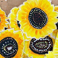 sunflowers are painted with dots on the petals