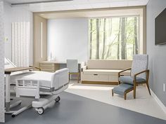 an empty hospital room with chairs and medical equipment