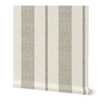 a white and grey striped wallpaper with vertical stripes on the bottom half of it