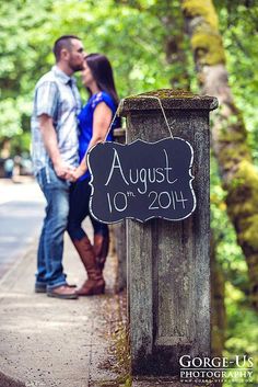 a couple kissing in front of a sign that says, 50 fall save the date & engagement photo ideas