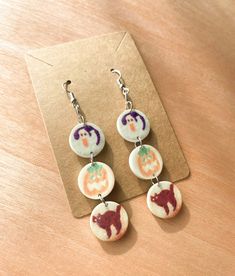 Get your spooky on with these adorable halloween cookie trio earrings! Perfect for the fall season! Made from sublimated acrylic! Ear wires are lead-free and nickle-free! Great for sensitive ears!  Measures 3 inches tall (including ear wire) and .8 inches wide  Ships attached to an earring card in its own clear packaging! Halloween Cookie Earrings, Animal Crossing Earrings, Weird Earrings Aesthetic, Silly Earrings, Halloween Magnets, Crazy Earrings, Weird Earrings, Spooky Earrings, Clear Packaging