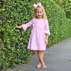 Your little one will fall in love with our Pink Check Olivia Dress for all their pumpkin patch adventures! This adorable Olivia-style dress, in charming pink gingham check, is perfect for endless pumpkin picking and fall festivities. Add a monogram to make this outfit uniquely theirs and even more fun! Coordinates perfectly with our Pumpkin Hayride collection. Cute Pink Plaid Dress With Ruffles, Cute Pink Plaid Dress For Spring, Playful Pink Fall Dress, Preppy Pink Ruffled Dress, Cute Long Sleeve Gingham Dress, Preppy Pink Ruffle Dress, Preppy Pink Dresses With Ruffles, Kid Pictures, Fall Festivities