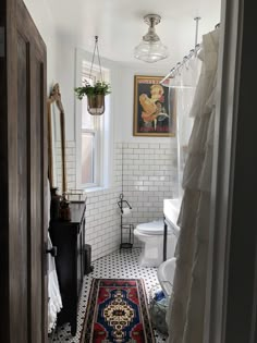 a bathroom with a rug on the floor