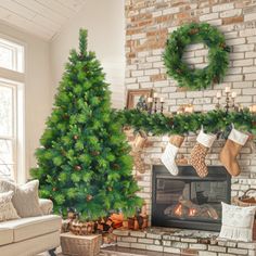 a living room with a christmas tree and stockings hanging on the fireplace mantels