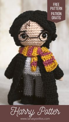 a crocheted harry potter doll with glasses and scarf