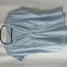 Lucky Brand Light Blue Tee With Two Pockets At The Front Chest Area. Linen Type Woven Fabric At Front From The Pockets Down With Cotton Modal Tee At Top And Back Of Shirt. Button Placket In Front. Laundered But Never Worn. Made Of 60% Cotton And 40% Modal. Woven Part Of Tee Is 100% Cotton. Blue Cotton V-neck Shirt, Casual Light Wash V-neck Top, Light Blue Casual V-neck Shirt, Casual Light Blue V-neck Shirt, Blue Buttoned T-shirt For Summer, Blue Button-up T-shirt For Summer, Relaxed Fit Light Wash Top With Buttons, Light Wash Relaxed Fit Top With Buttons, Light Wash Buttoned Top For Work