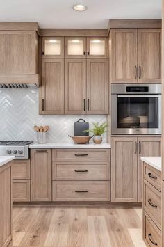 a kitchen with wooden cabinets and white counter tops