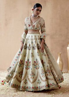 Editor's Note Presenting a refreshing mint green dupion silk lehenga set adorned with intricate floral thread embroidery, elegantly highlighted with various embellishments. This captivating ensemble is paired with an embroidered blouse and dupatta, creating a graceful and regal look perfect for special occasions or elegant gatherings. The soothing mint green hue, the delicate embroidery, and the ornate details on both the blouse and dupatta add a touch of opulence, making this outfit a statement Choli Ideas, Floral Bridal Lehenga, Outfits Traditional, Floral Thread Embroidery, Wedding Lenghas, Clothes Embroidery, Best Wedding Colors, Clothes Embroidery Diy, Makeup Images