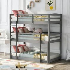 the bunk bed is made with metal frame and has three levels to hold two children's beds