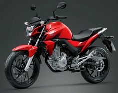 a red and black motorcycle on a gray background