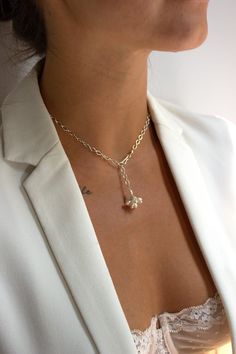 Classic and minimal - The Fleurette Necklace is made from 14k gold filled or sterling silver openwork chain and features a hand-fabricated freshwater pearl "fleurette" cluster drop. The hook closure allows you to adjust the drop length. This style looks great alone but also layers well. Such a great piece for everyday wear and to enjoy for years to come. Handmade in New York Material: 14k gold filled or sterling silver Measures: 17" in length. Custom sizes are available, please send an email Clo Sterling Silver Lariat Necklace With Pearl Drop, Elegant Sterling Silver Lariat Charm Necklace, Silver Minimalist Lariat Pearl Necklace, Minimalist Silver Lariat Pearl Necklace, Sterling Silver Lariat Necklace With Pearl Pendant, Sterling Silver Lariat Pearl Chain Jewelry, Adjustable Sterling Silver Elegant Chain Necklace, Sterling Silver Pearl Drop Lariat Necklace, Dainty Silver Lariat Necklace With Pearl Drop