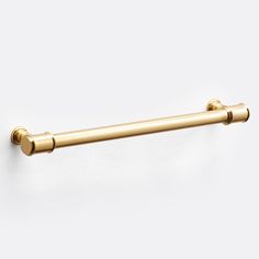 an image of a gold towel bar on the wall