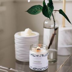 a candle and some flowers on a table