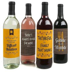 three bottles of wine with labels on them